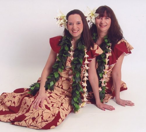 Hula instructors Bev and Dawn in red hula costumes