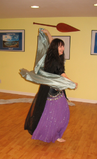 Maia demonstrates a spin with a veil